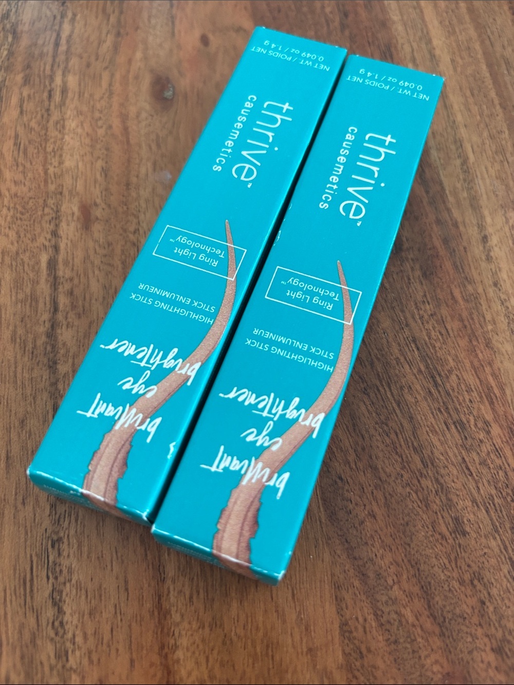 thrive causemetics Teal Boxes with Rose-Gold Accent Liquid Highlighters